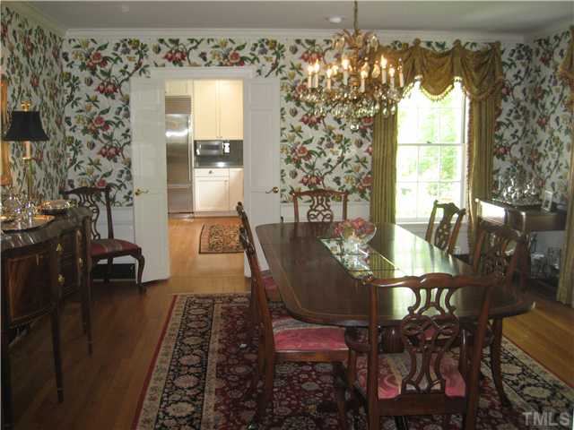 418 Yarmouth Road Raleigh, NC 27608 - Photo 6 of 25 a dining room with furniture a chandelier and window