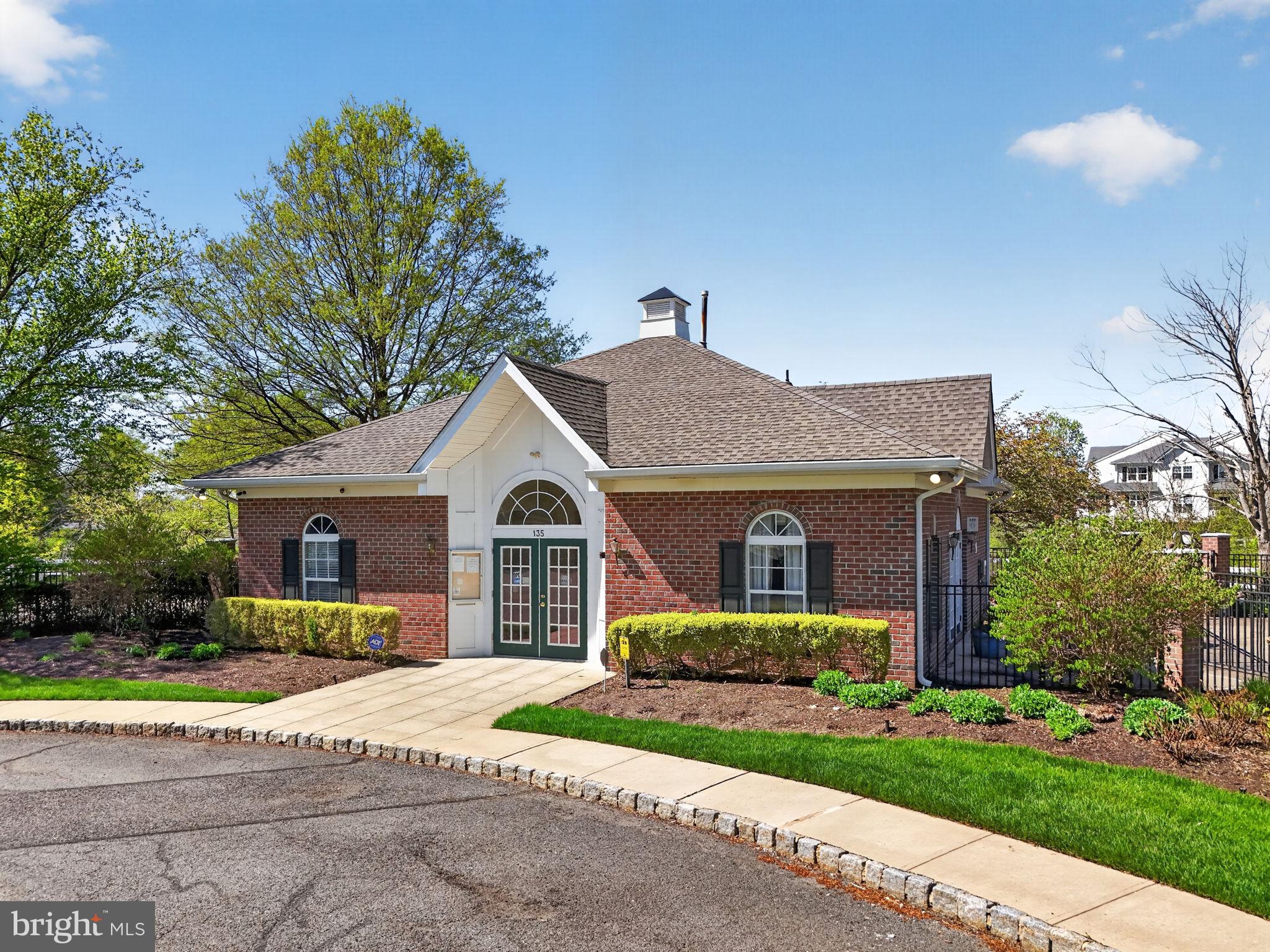 1 Warwick Road Princeton Junction, NJ 08550 - Photo 34 of 45 Charming brick residence with lush greenery.