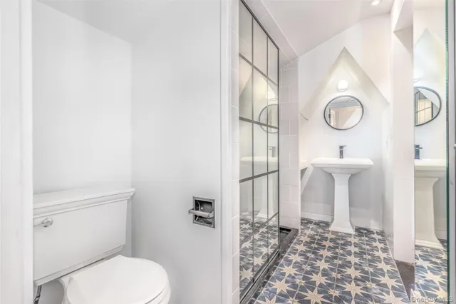 a bathroom with a toilet and a sink