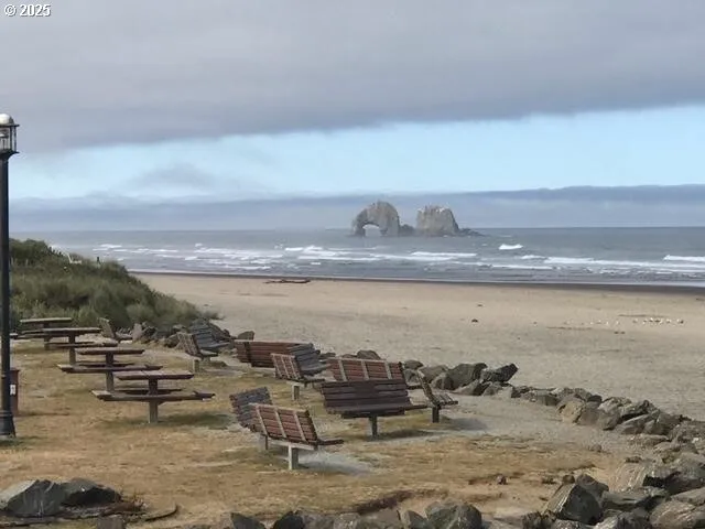 a view of a hallway with wooden floor windows