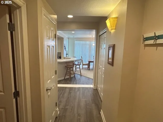 a bedroom with a bed and a night stand