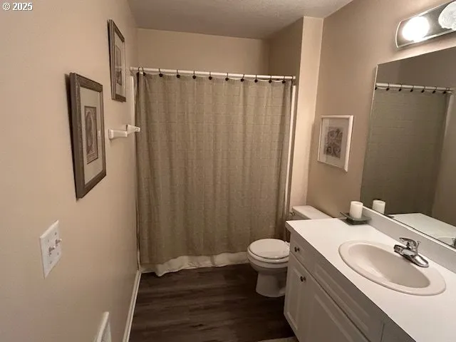 a balcony with chairs and wooden floor