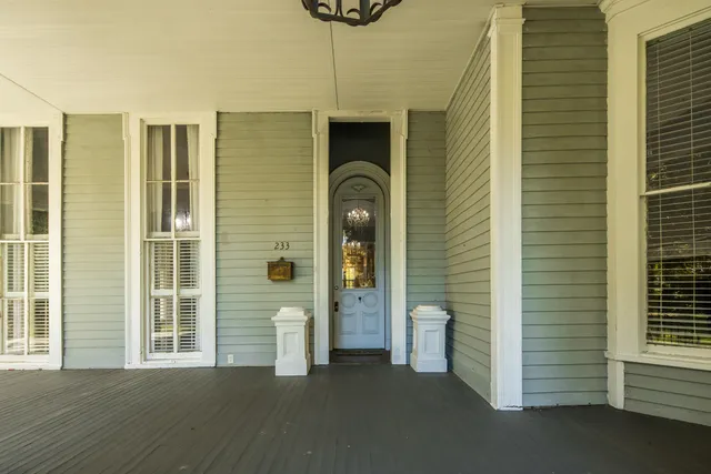 a view of a hallway with windows