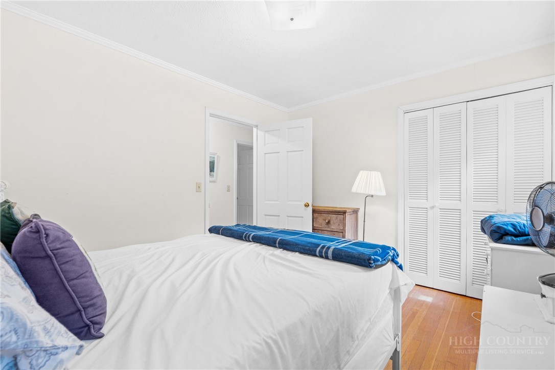 1794 Highway 105 Boone, NC 28607 - Photo 26 of 29 a bedroom with a bed and a couch