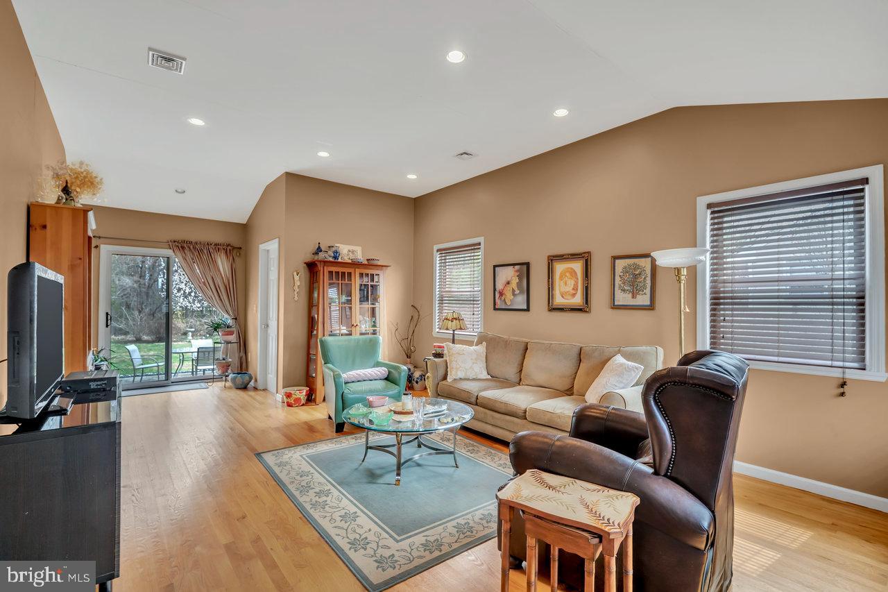 26 Sun Valley Road Hamilton, NJ 08690 - Photo 16 of 26 a living room with furniture and a flat screen tv