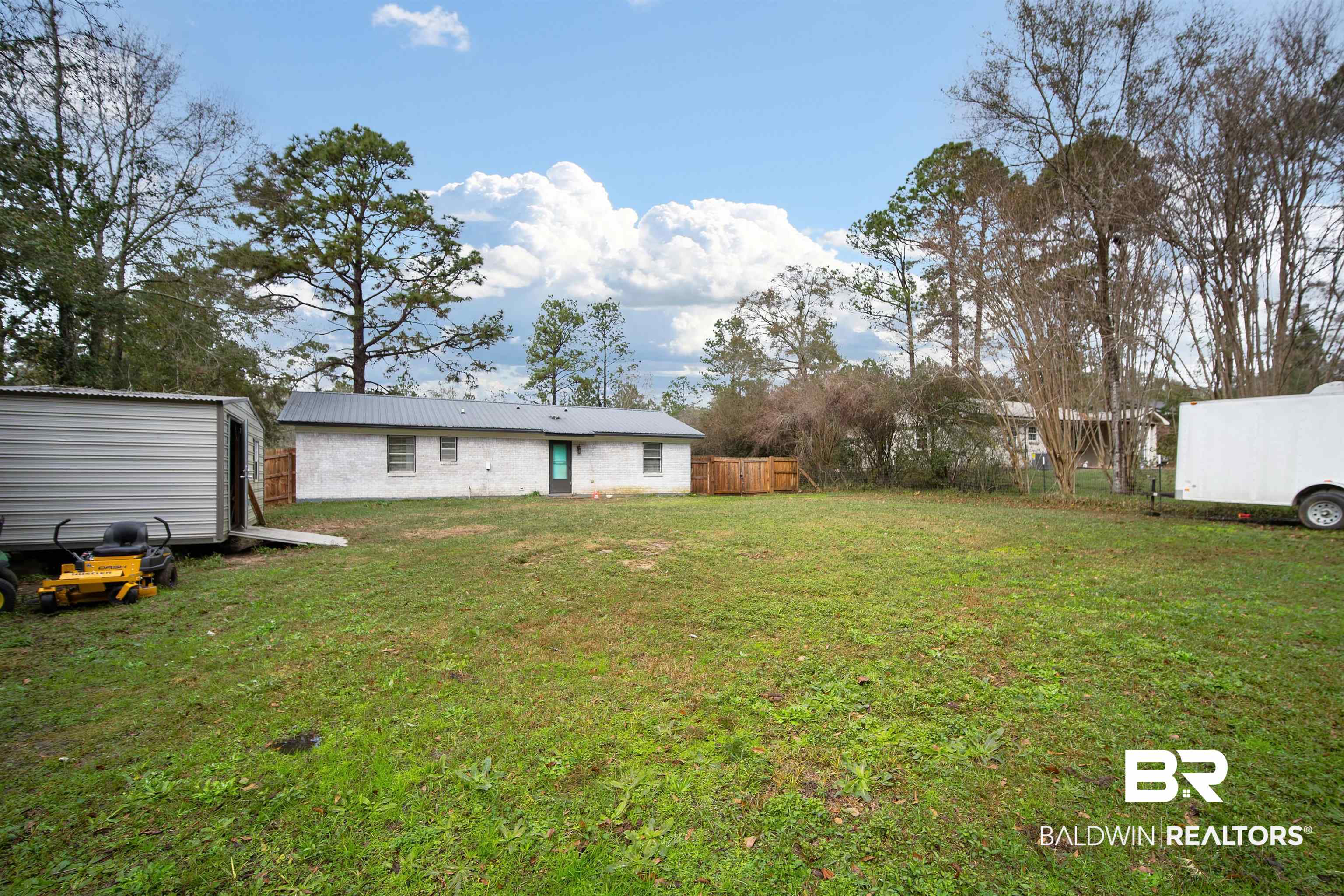 5110 Wilmer Road Wilmer, AL 36587 - Photo 22 of 24 View of yard with a storage unit