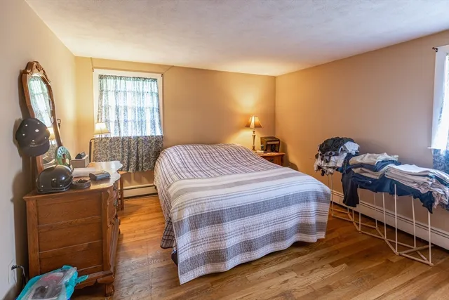 a kitchen with kitchen island granite countertop a sink counter top space appliances and cabinets