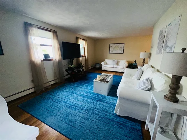 a bed room with furniture and a potted plant