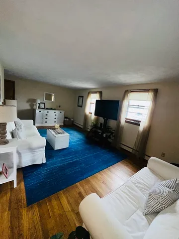 a bedroom with a bed and a table in it