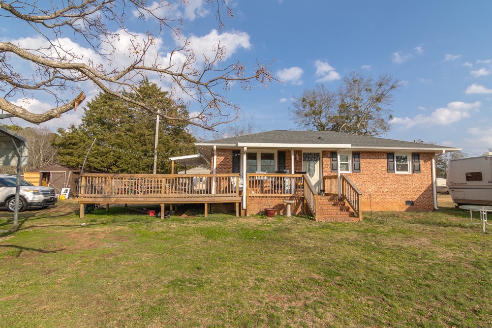 708 Sexton Gin Road Iva, SC 29655 - Photo 19 of 20 This charming residence features a classic brick exterior and a spacious outdoor deck for enjoyment.