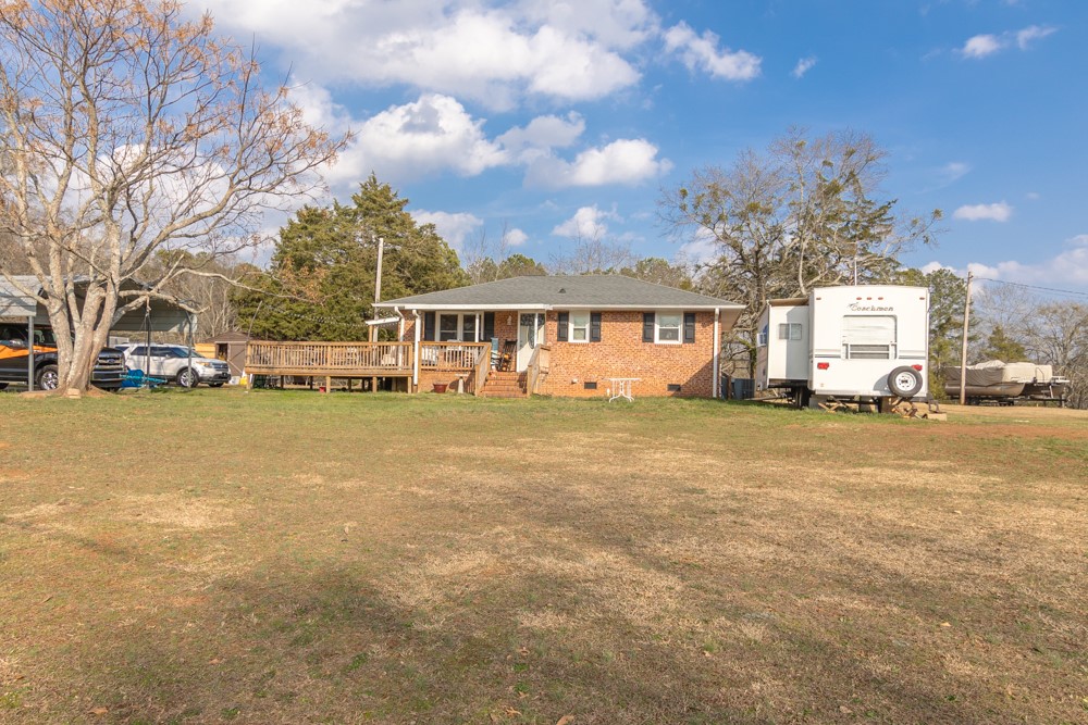 708 Sexton Gin Road Iva, SC 29655 - Photo 20 of 20 This charming brick home offers ample outdoor space and a welcoming deck for enjoyment.