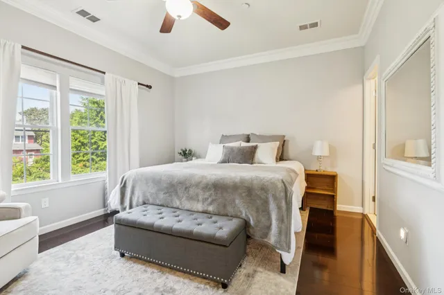 a bedroom with a large bed and a couch