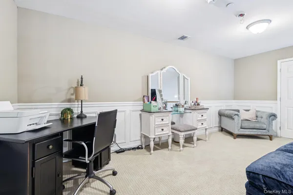 a view of a workspace with furniture