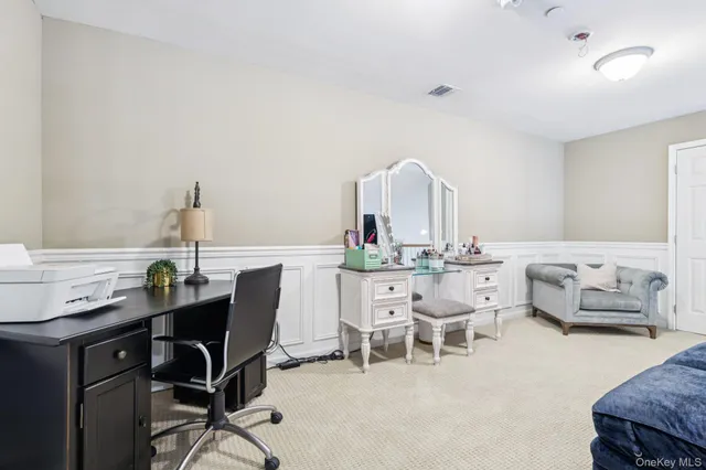 a view of a workspace with furniture