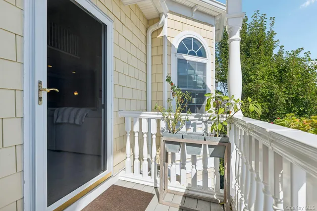 a view of balcony with furniture