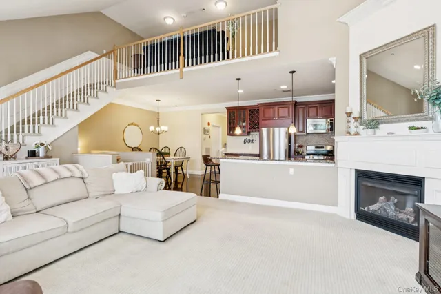a living room with fireplace furniture and a flat screen tv