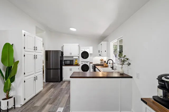 a kitchen with a table and chairs in it