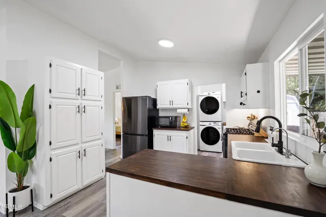 a bedroom with furniture and a book shelf