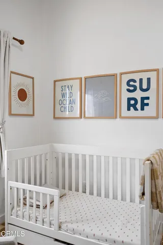 a bathroom with a sink mirror and a toilet