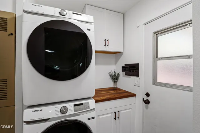 a backyard of a house with yard and outdoor seating