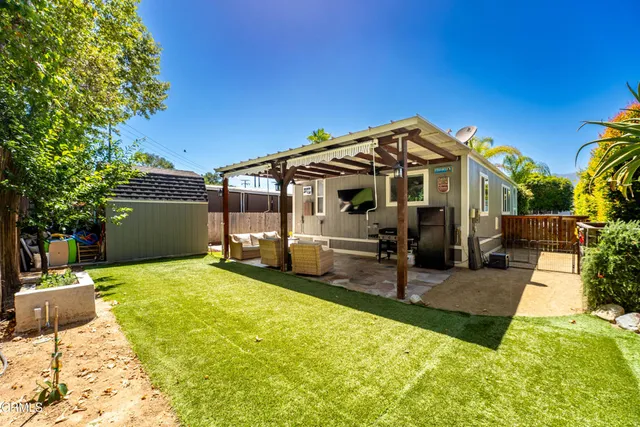 a view of balcony with wooden floor and outdoor seating