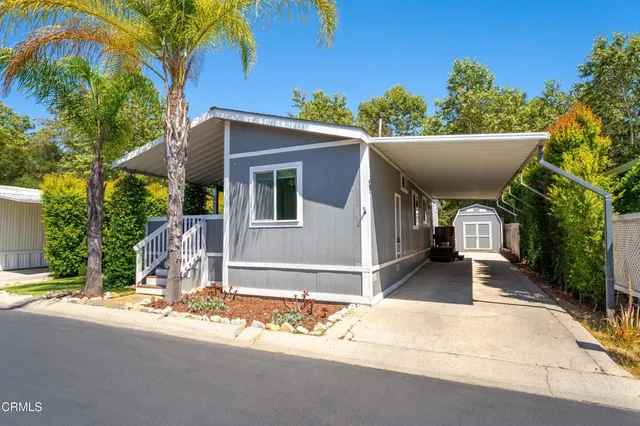 a view of house with backyard