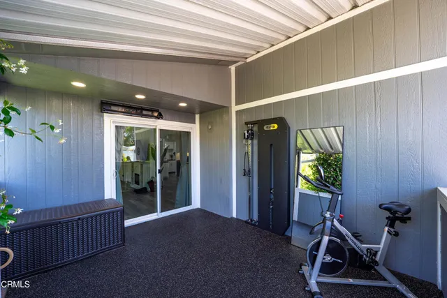 swimming pool view with a seating space and a garden view