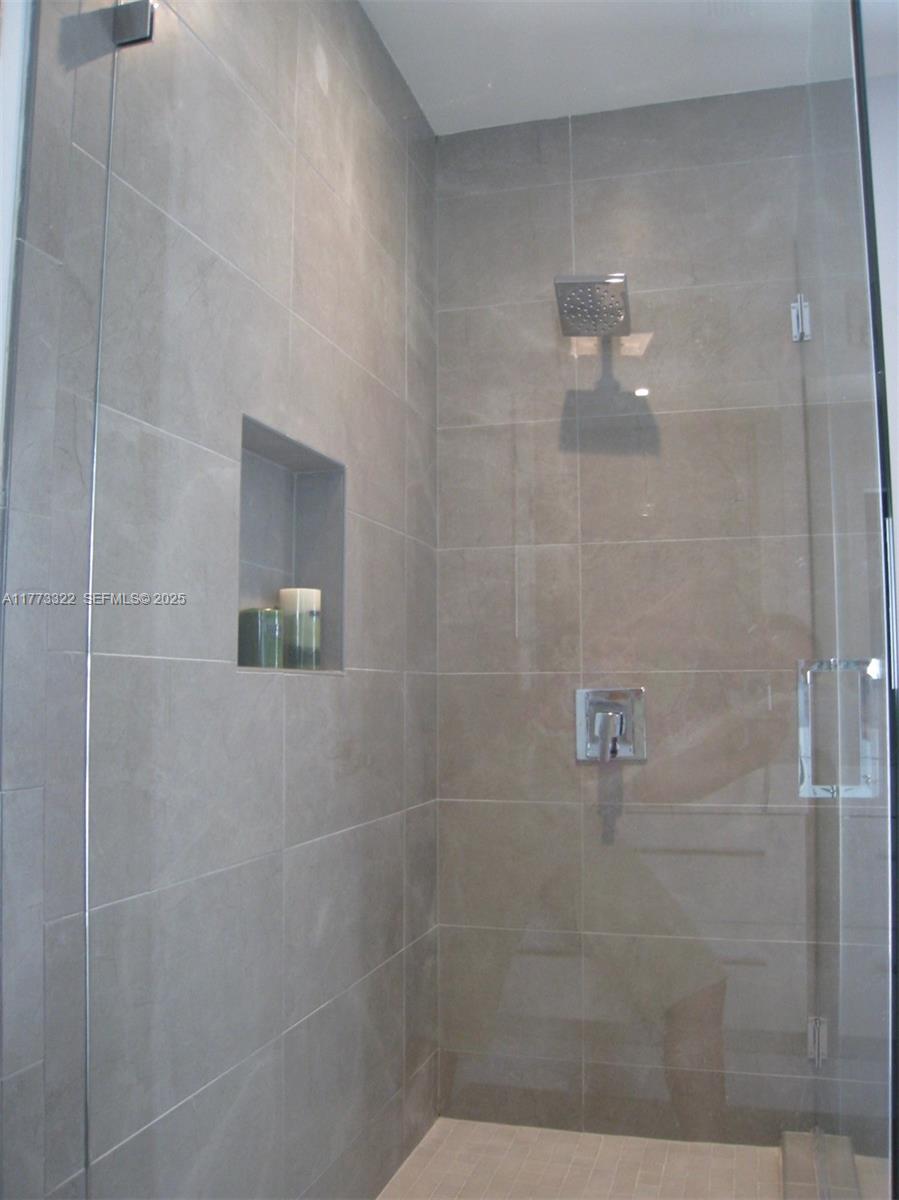 7125 Southwest 120th Street Pinecrest, FL 33156 - Photo 13 of 27 a bathroom with a shower
