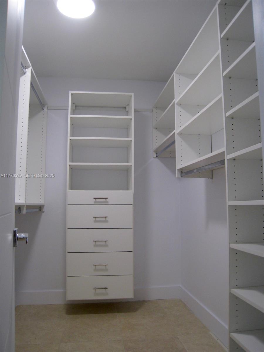 7125 Southwest 120th Street Pinecrest, FL 33156 - Photo 14 of 27 a view of walk in closet