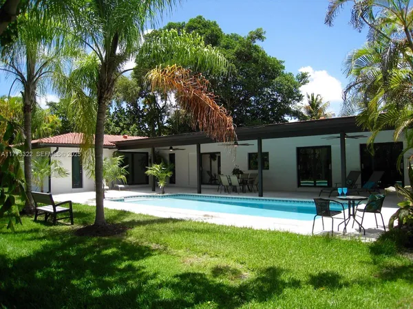 front view of a house with a garden