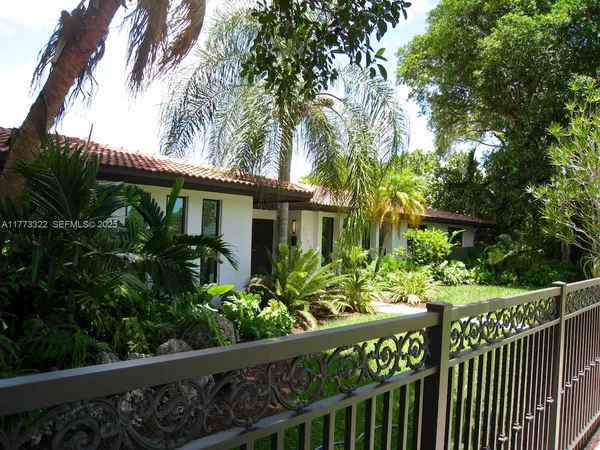 a view of backyard with green space