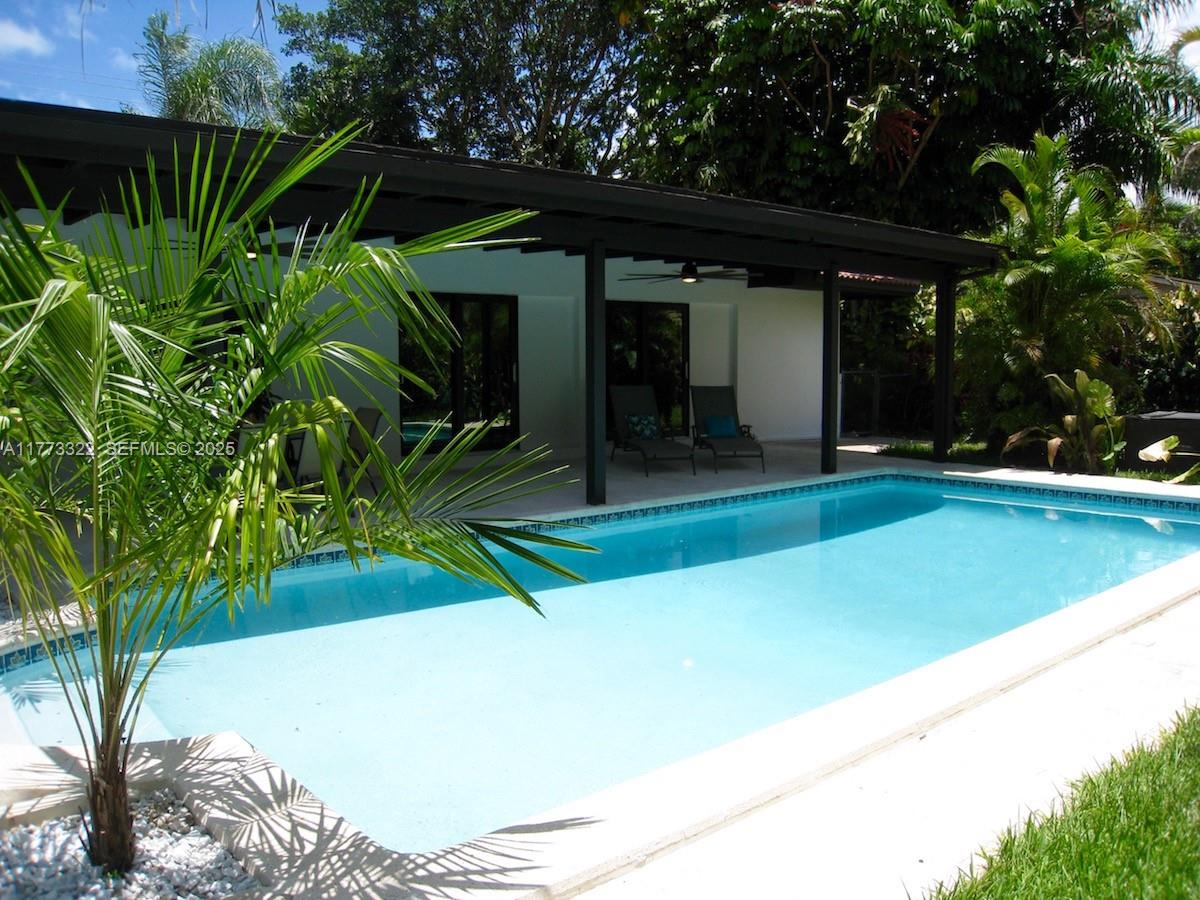 7125 Southwest 120th Street Pinecrest, FL 33156 - Photo 10 of 27 a view of a backyard