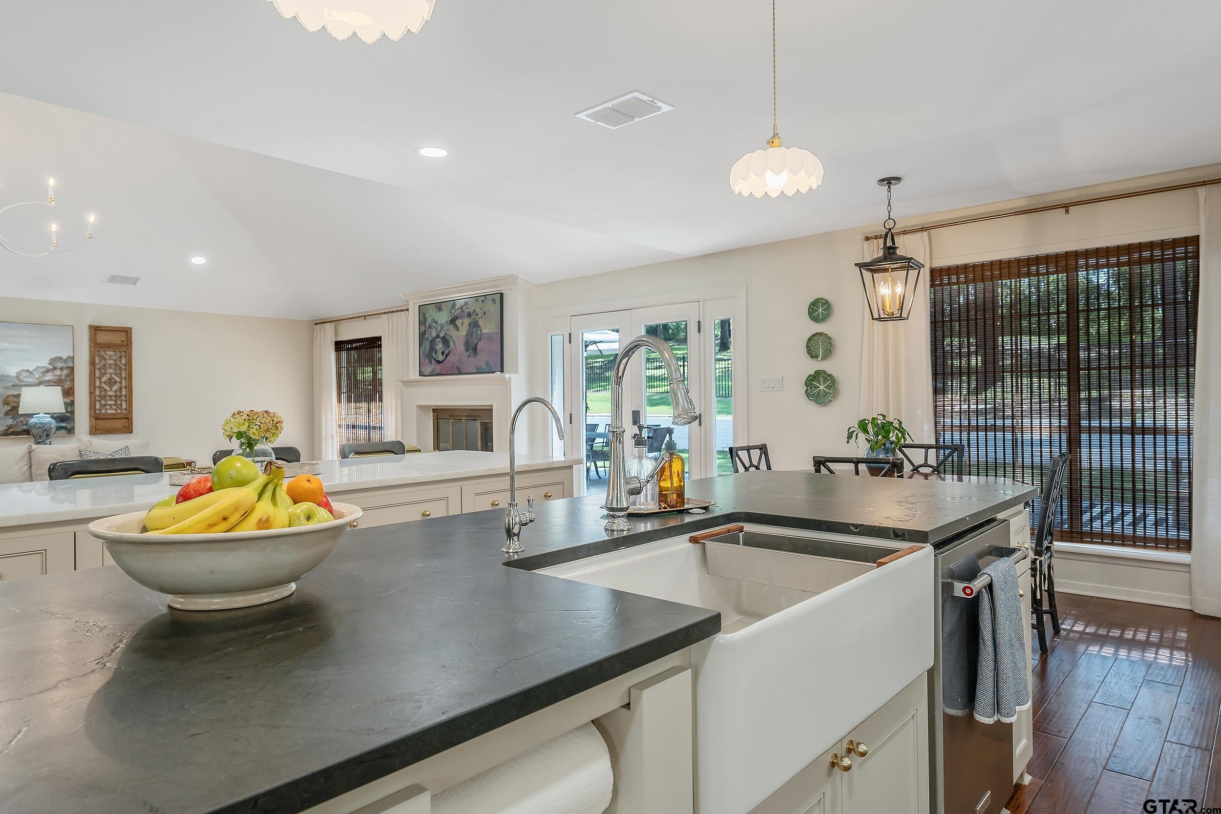 16708 Beddingfield Road Flint, TX 75762 - Photo 12 of 40 a view of a kitchen with a sink and living room