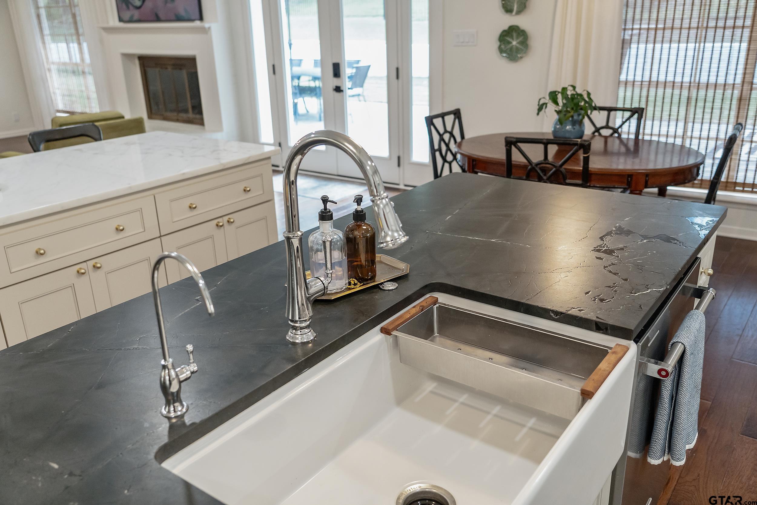 16708 Beddingfield Road Flint, TX 75762 - Photo 15 of 40 a view of a kitchen counter top space with furniture and a fireplace
