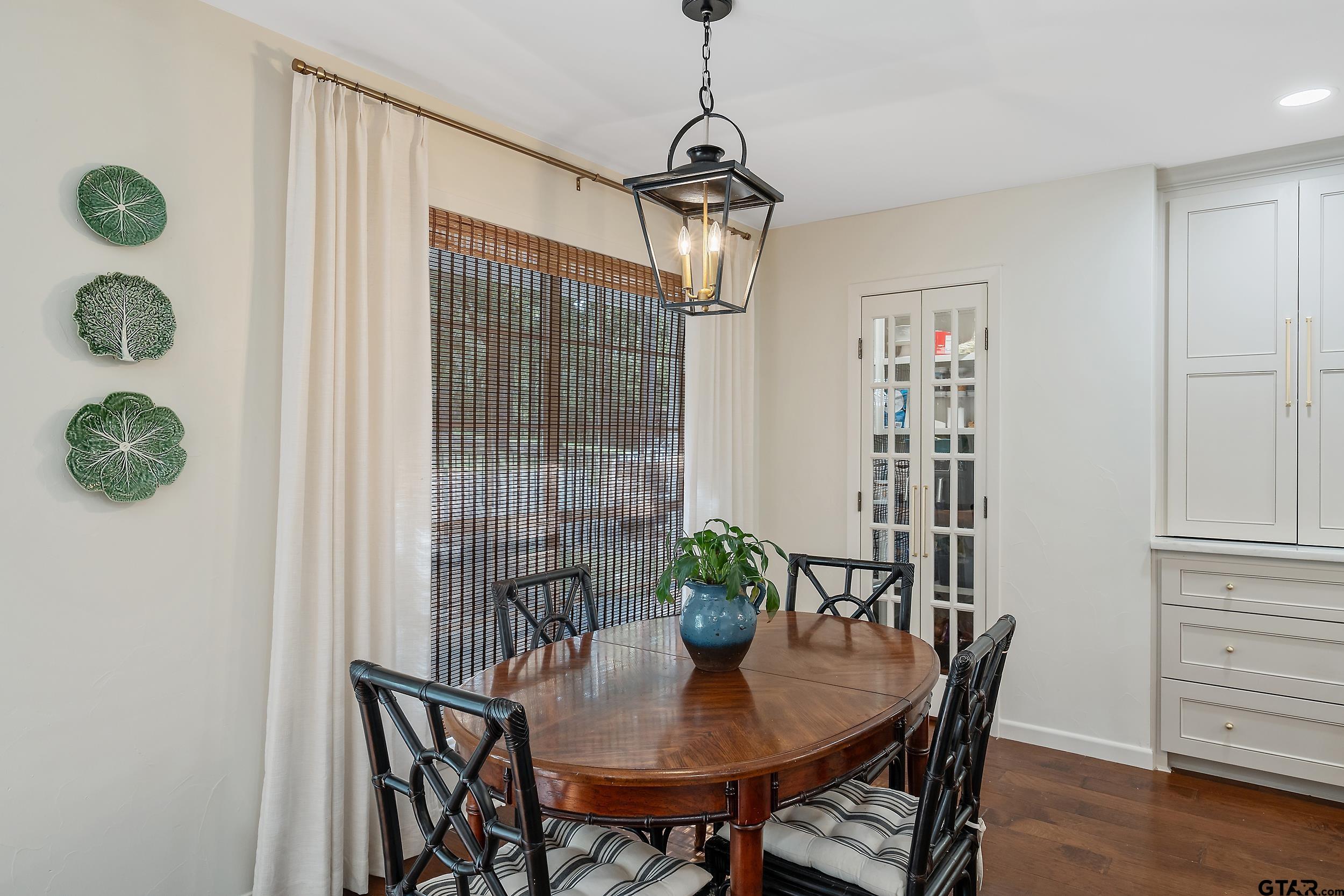 16708 Beddingfield Road Flint, TX 75762 - Photo 17 of 40 a view of a dining room with furniture and wooden floor