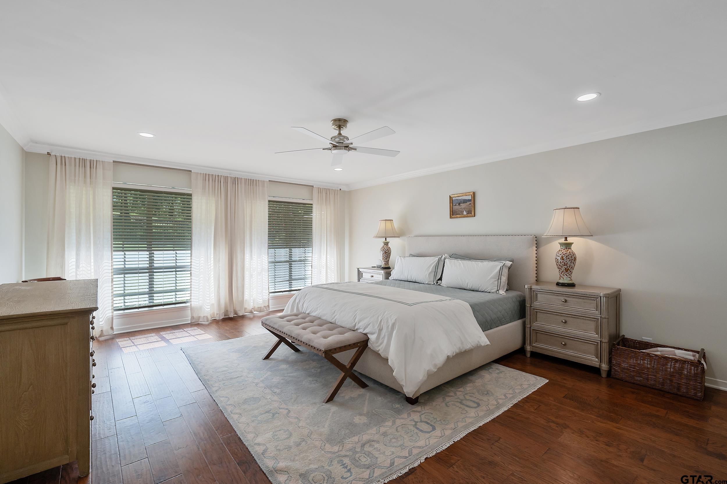 16708 Beddingfield Road Flint, TX 75762 - Photo 20 of 40 a spacious bedroom with a bed and glass door