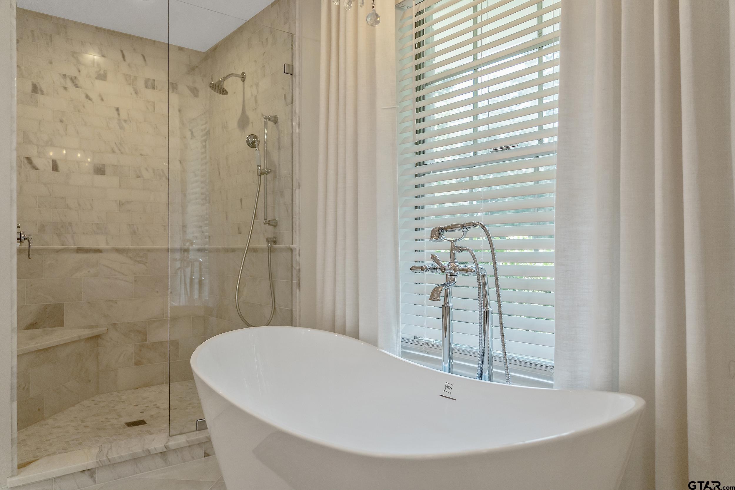 16708 Beddingfield Road Flint, TX 75762 - Photo 24 of 40 a bathroom with a bathtub and shower
