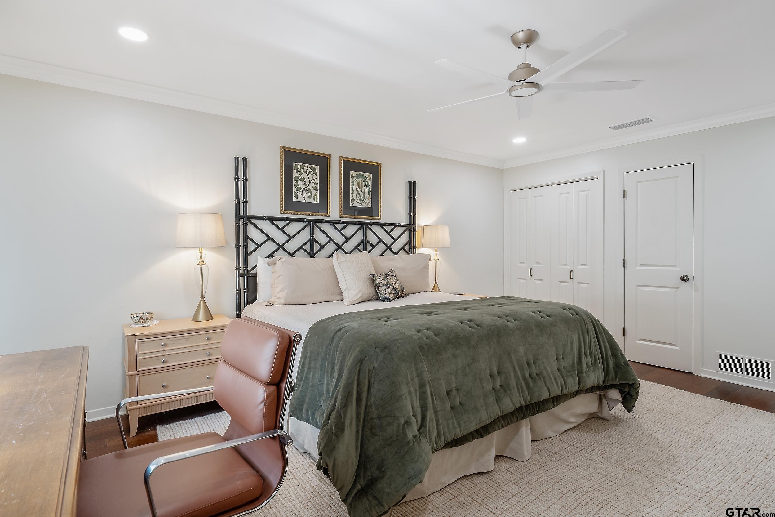 16708 Beddingfield Road Flint, TX 75762 - Photo 28 of 40 a spacious bedroom with a bed and furniture