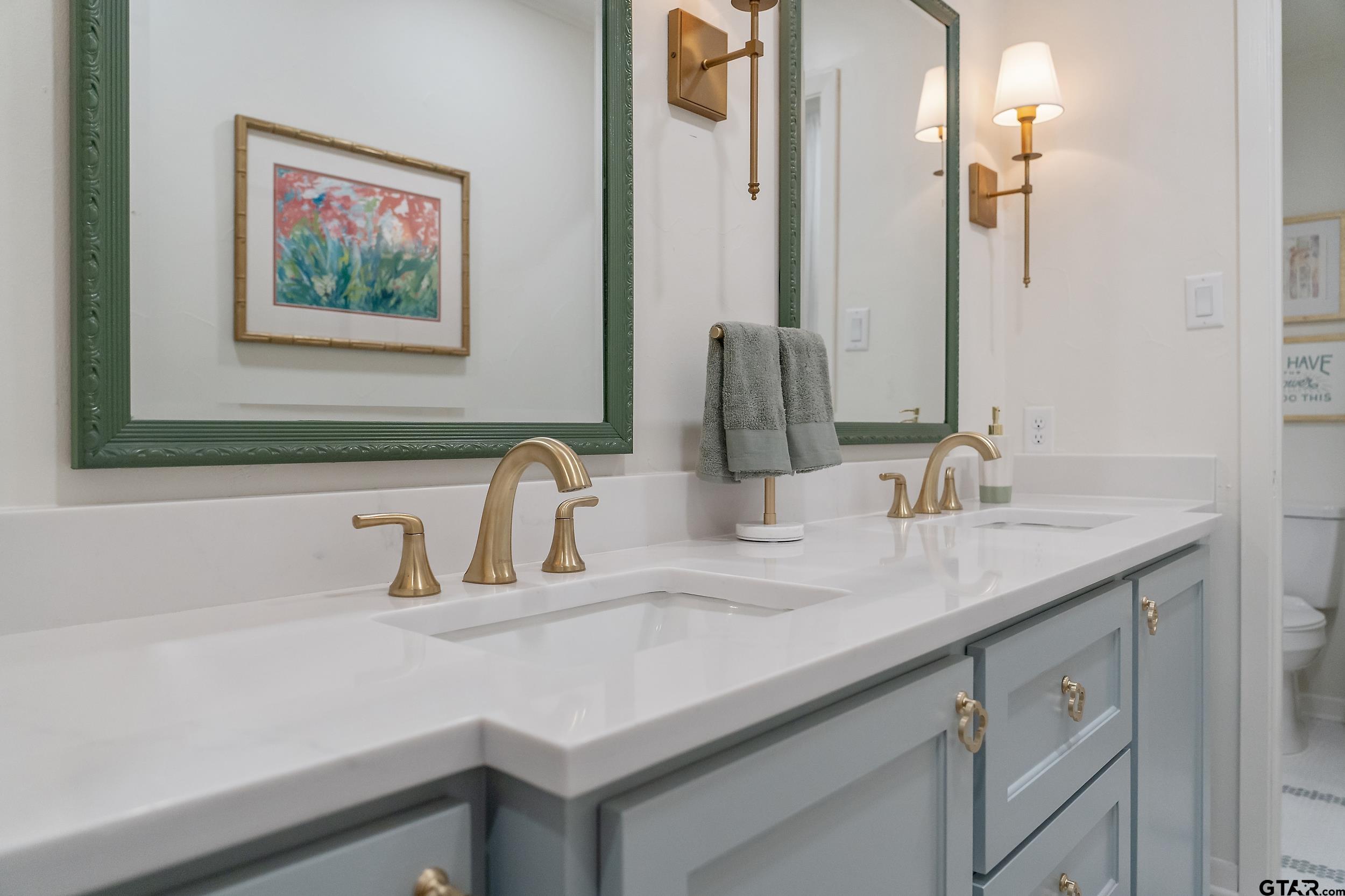16708 Beddingfield Road Flint, TX 75762 - Photo 30 of 40 a bathroom with a sink and a mirror