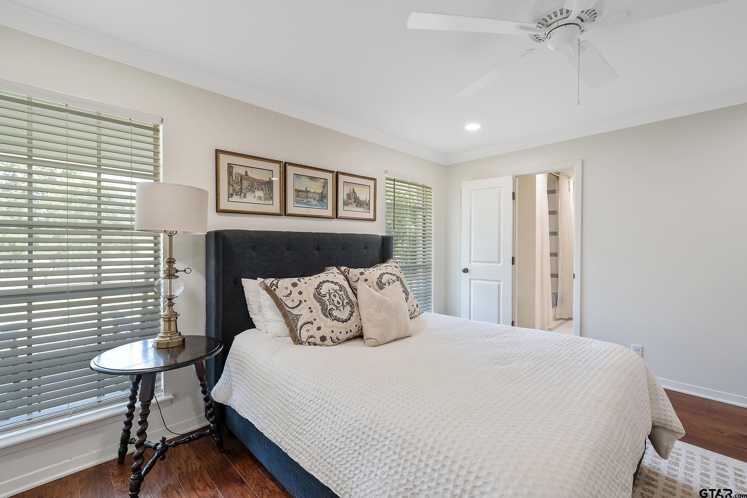 16708 Beddingfield Road Flint, TX 75762 - Photo 32 of 40 a bedroom with a bed and a chandelier