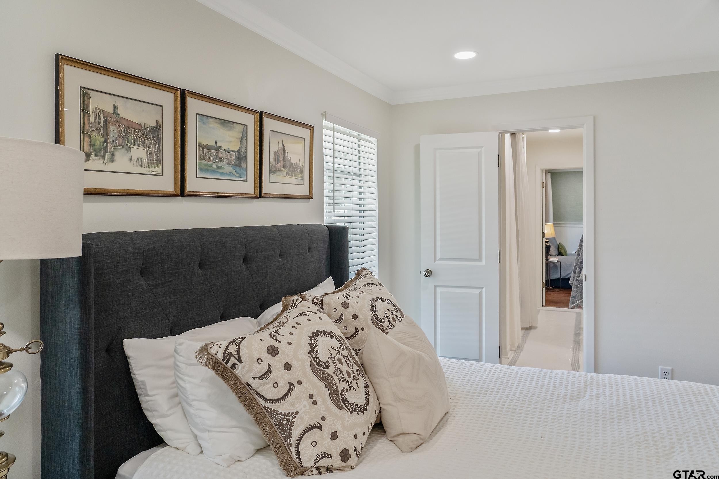 16708 Beddingfield Road Flint, TX 75762 - Photo 33 of 40 a bedroom with a bed and a painting on the wall