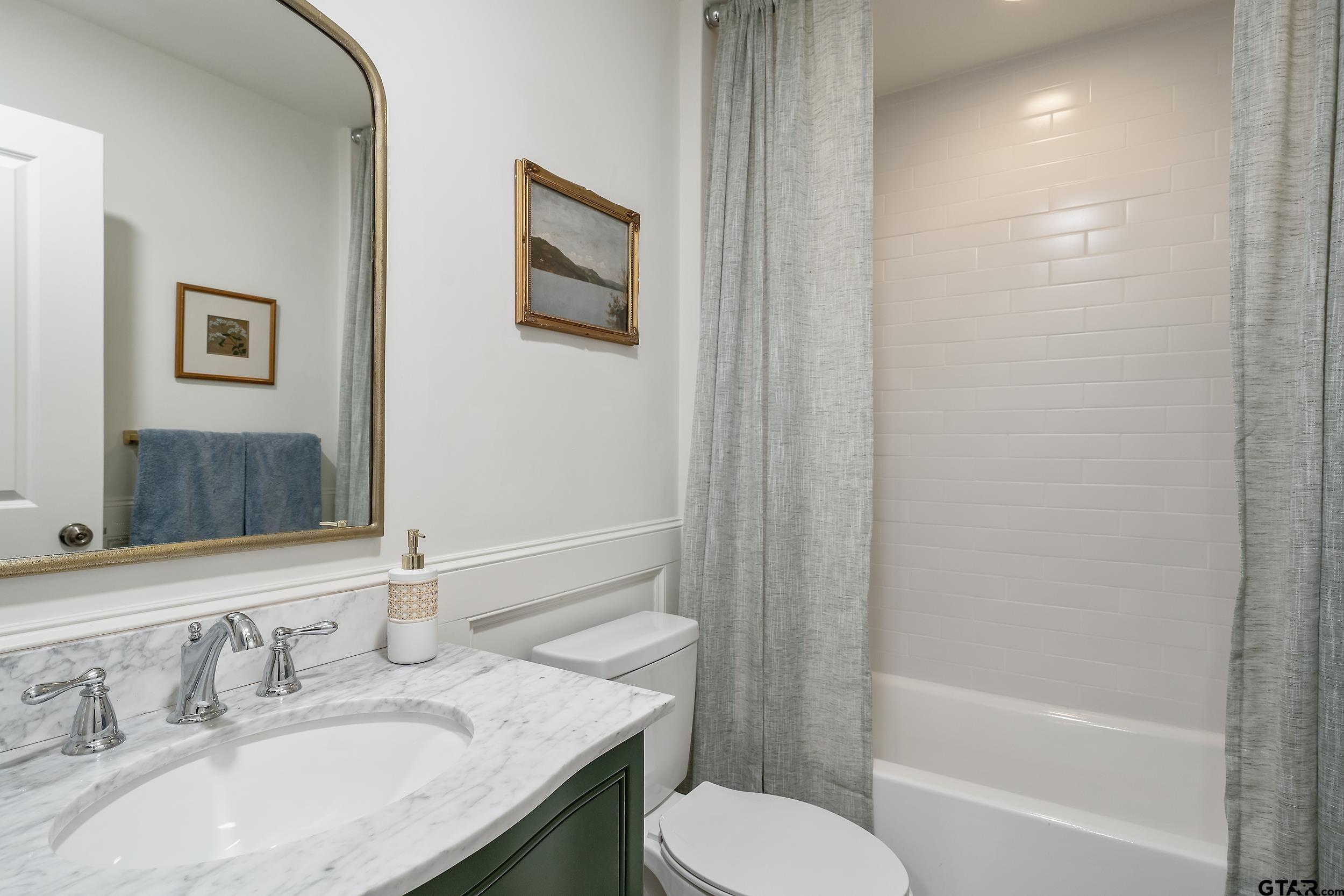 16708 Beddingfield Road Flint, TX 75762 - Photo 34 of 40 a bathroom with a granite countertop sink toilet and shower