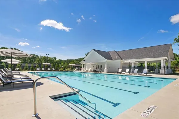 a view of a patio with swimming pool