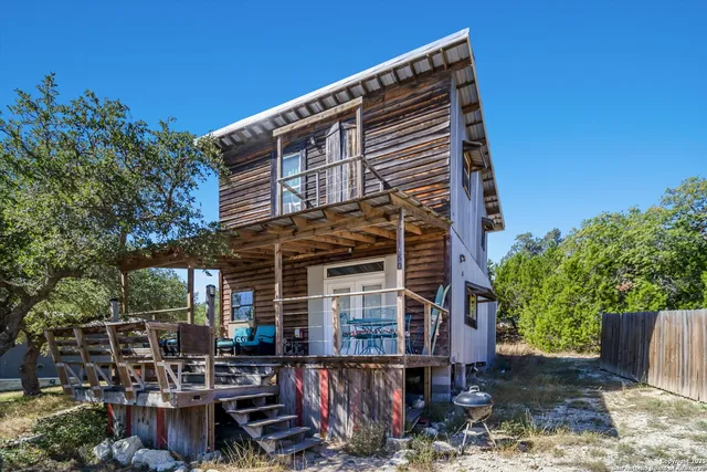 a view of house with backyard space and patio