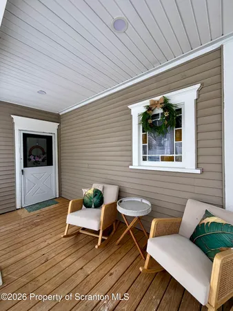 a outdoor living space with furniture and wooden floor