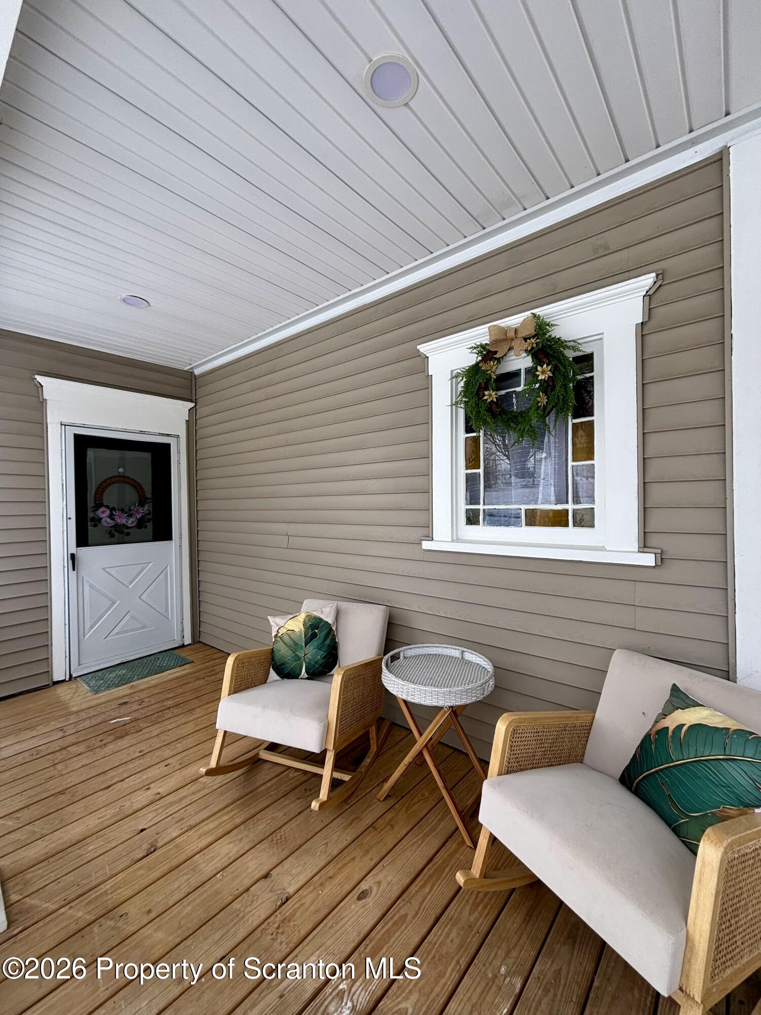 a outdoor living space with furniture and wooden floor
