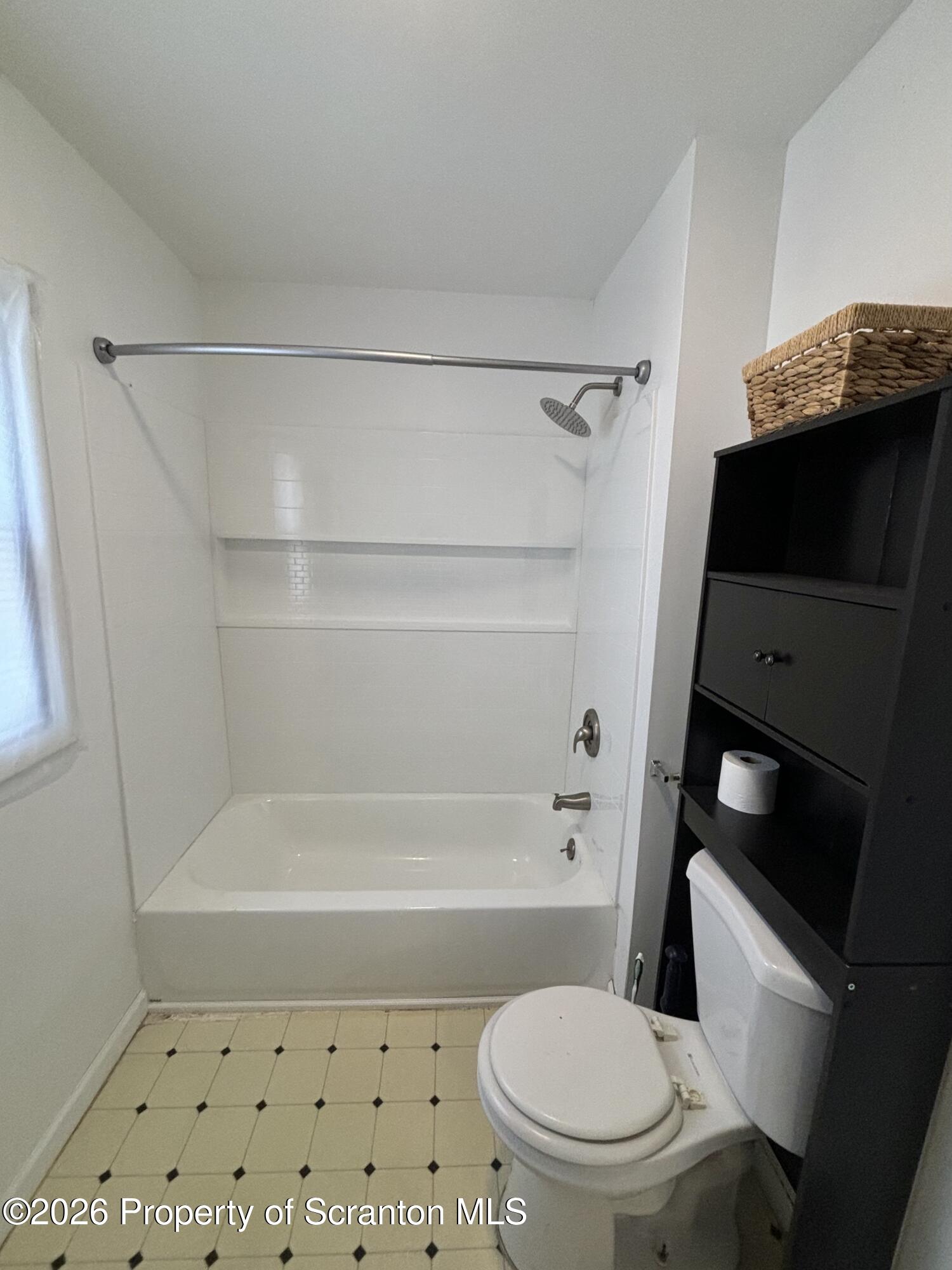 277 Riverside Drive Factoryville, PA 18419 - Photo 6 of 12 a bathroom with a sink a toilet and a shower