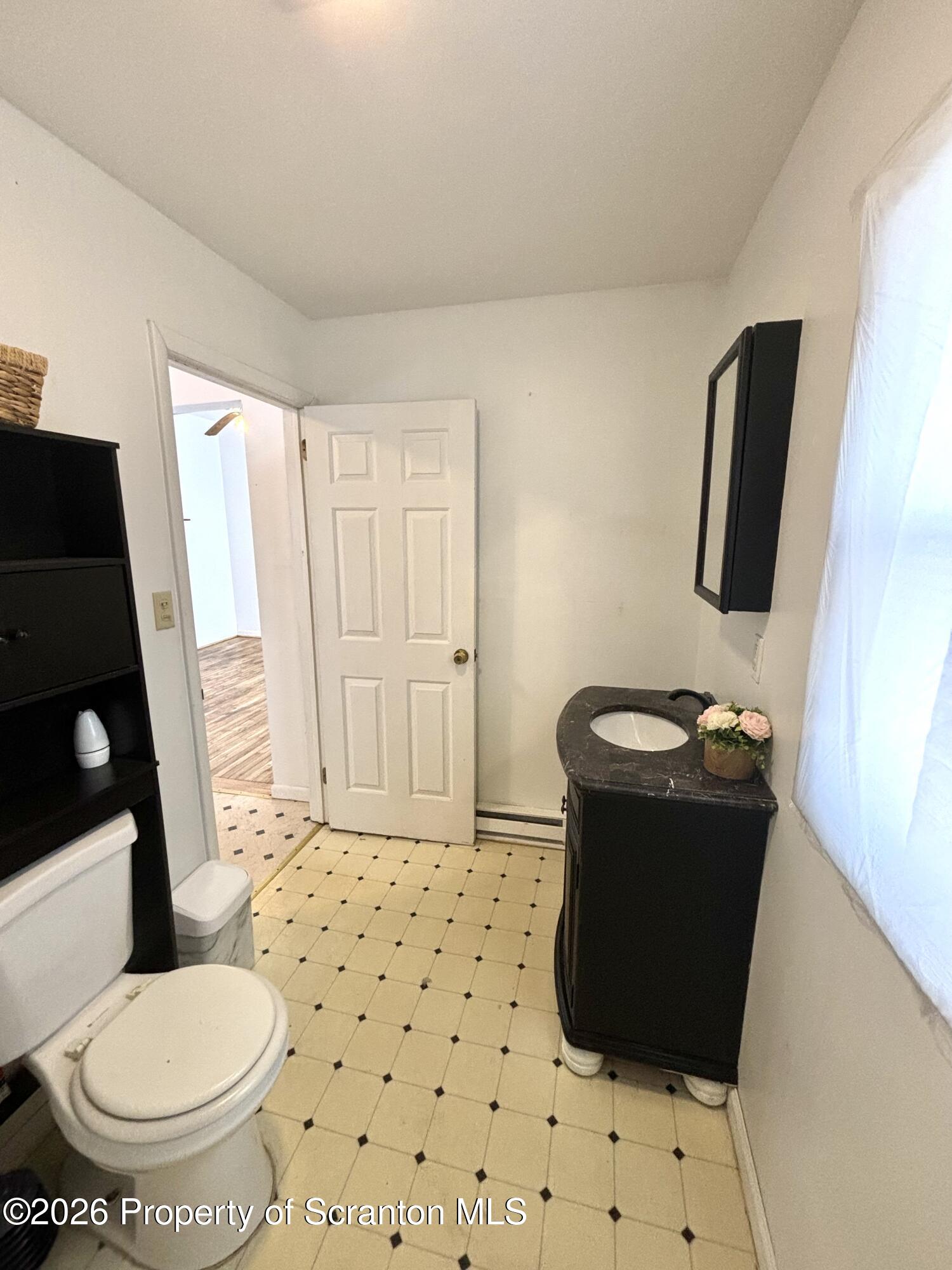 277 Riverside Drive Factoryville, PA 18419 - Photo 7 of 12 a bathroom with a sink toilet and shower