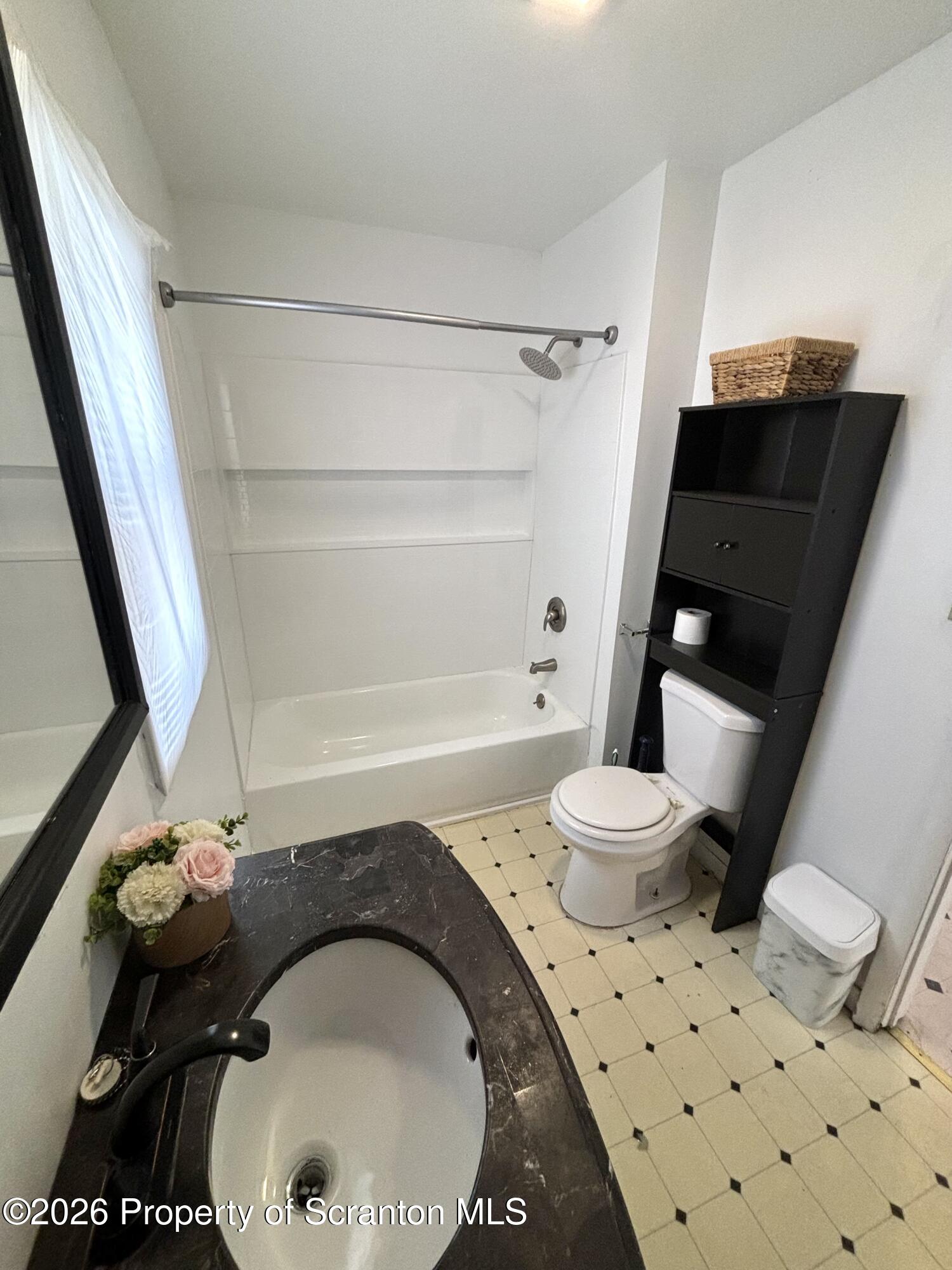 277 Riverside Drive Factoryville, PA 18419 - Photo 8 of 12 a bathroom with a sink toilet and shower