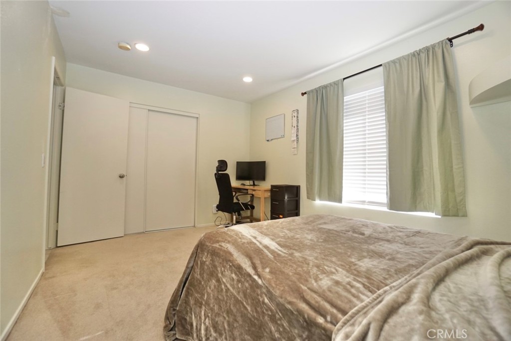 44557 La Paz Road Temecula, CA 92592 - Photo 12 of 24 a bedroom with a bed and a desk